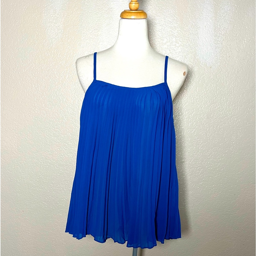 The Hanger Beautiful royal blue, pleated sleeveless blouse.